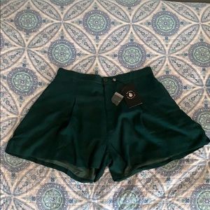 Dark green “Jane Plain” shorts. From ModCloth